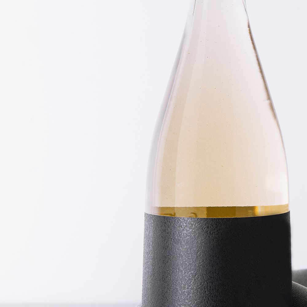 Study: close-up of a textured black label against the glass